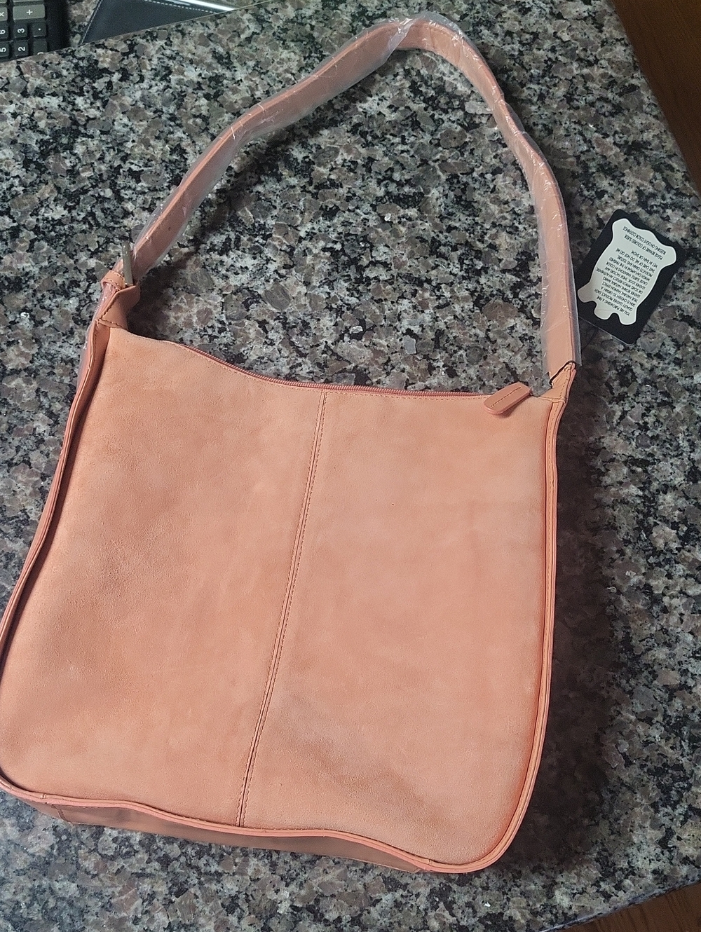 New with tags Jerry Lewis peach suede purse super cute and soft square shape
